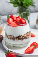 Granola with yogurt and strawberries in a glass