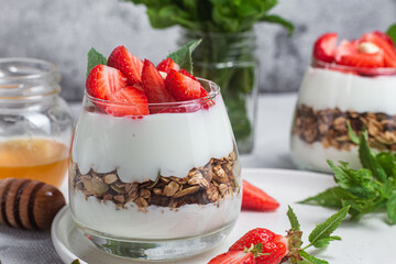 Granola with yogurt and strawberries in a glass