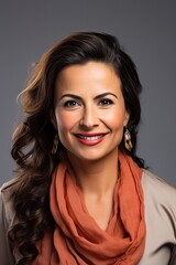 Fototapeta premium headshot of a happy mature woman looking at the camera on gray background