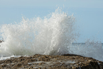 Beautiful sea waves with foam of blue and turquoise color. Natur ocean background in Portugal