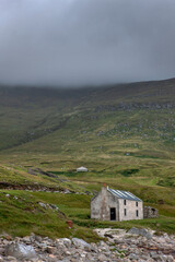 Westcoast Ireland. Abandoned house in misty and foggy landschape. Keel. 