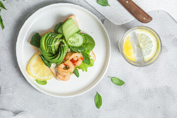 Sandwich with cream cheese, shrimp, avocado and cucumber