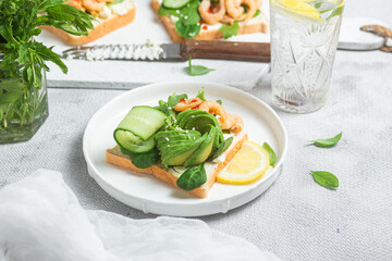 Sandwich with cream cheese, shrimp, avocado and cucumber
