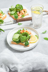 Sandwich with cream cheese, shrimp, avocado and cucumber