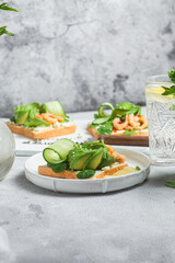 Sandwich with cream cheese, shrimp, avocado and cucumber