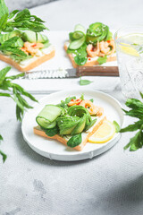 Sandwich with cream cheese, shrimp, avocado and cucumber