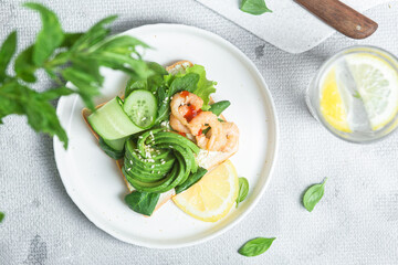 Sandwich with cream cheese, shrimp, avocado and cucumber