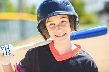 Young girl play baseball on summer day