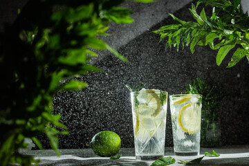 Cocktail with lemon and mint on a dark background. Lemonade