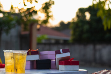Beer drinks prepared for barbecue party among friends are served in plastic glasses because plastic glasses can be easily stored at end of party. Easy party idea by serving beer in plastic glasses.