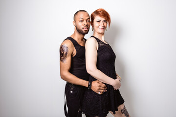 black Man with black clothes on studio white background with woman