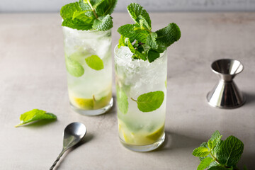 Homemade Mojito Cocktail refreshment rum, lime juice, mint leaves and soda water 