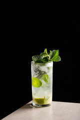 Homemade Mojito Cocktail refreshment rum, lime juice, mint leaves and soda water 