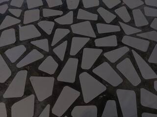 Irregular shaped white ceramic tiles. Abstract background and texture