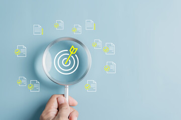 Magnifier glass focus to target icon which for planning development leadership and customer target group concept...