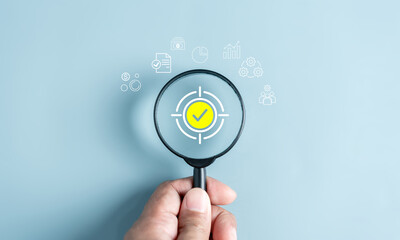 Magnifier glass focus to target icon which for planning development leadership and customer target group concept...