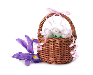 Wicker basket with beautifully painted Easter eggs and iris flowers isolated on white