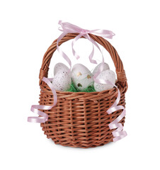 Wicker basket with beautifully painted Easter eggs isolated on white