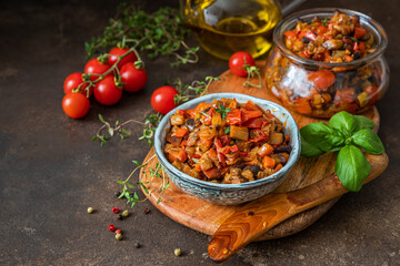 Homemade vegetable caviar with eggplant, tomatoes, onions, zucchini, carrots, spices and herbs