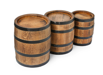 Obraz premium Three traditional wooden barrels on white background