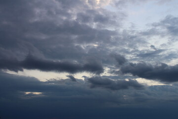 Naklejka na ściany i meble A cloudy sky with clouds