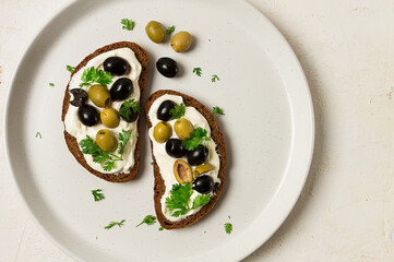Breakfast, sandwiches, with cream cheese, olives, top view,