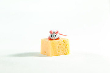 Little plasticine mice and a piece of cheese with holes.