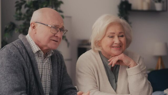 Smiling senior couple consulting with family doctor, health care and insurance