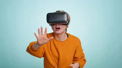 Woman using virtual reality futuristic technology VR app headset helmet to play simulation 3D 360...