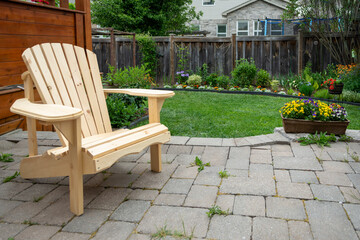 Garden wooden chair in the backyard