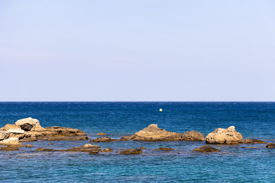 Archipelago in greece with cliffs and clean sea horizon