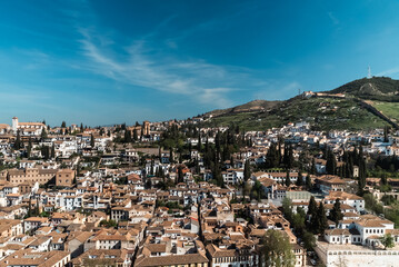 Granada,Spain. April 14, 2022:  Albaicin neighborhood architecture and blue sky. Panoramic landscape of the neighborhood.