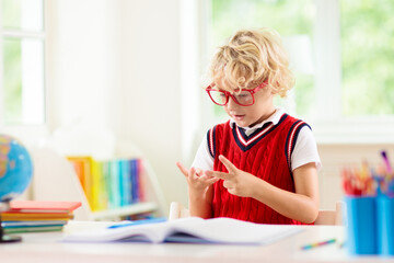 Kids doing homework. Children go back to school.