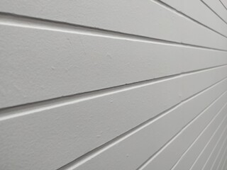 Straight line texture on white wall