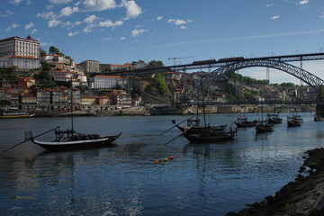 Barges used to carry port on the River Douro and the Terreiro da Sé in the city of Porto, Portugal 