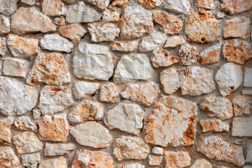 A wall made out of worked stones.