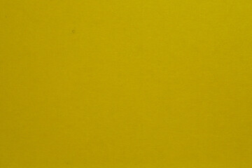 Yellow  paper texture background or cardboard surface from a paper. For the designs decoration and nature background concept