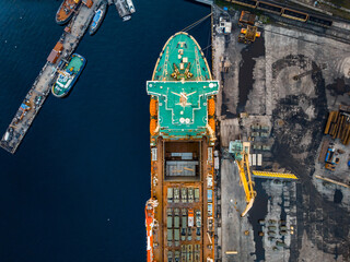 Aerial top view cargo ship with military equipment for transportation humanitarian aid, army forces for war © Parilov