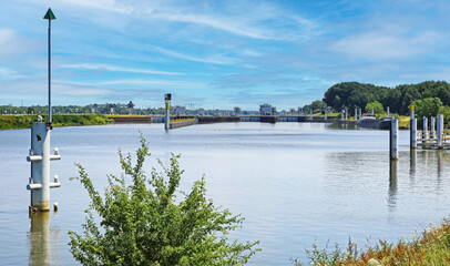 Sambeek, Netherlands - June 9. 2023: Large lock sluice facility complex at dutch river Maas