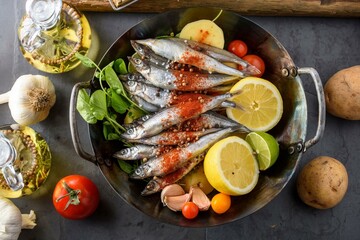 Gorgeous Top Close-Up of Raw Shishamo (Candlefish) with Spice and Vegetables in a Pot, Filmed in Exquisite 4K Resolution