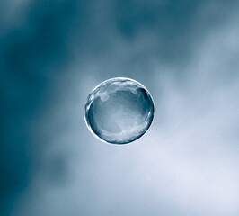 Macro details of a soap bubble floating in the sky	