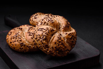 Delicious freshly baked crispy bun or kaiser roll with sesame seeds