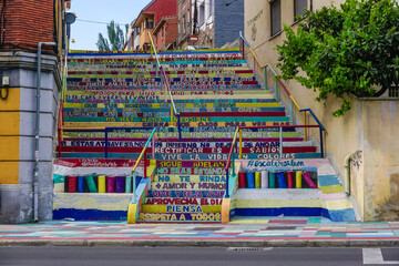Staircase painted in bright colors with positive phrases