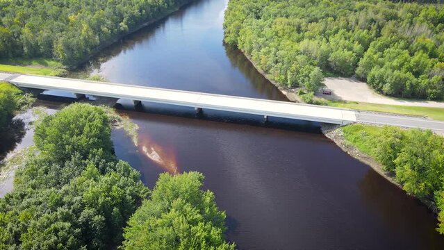 Flying over a river and forest in Northern Minnesota near the border of Canada