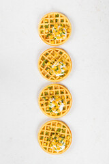 Vegan Round Corn waffles. White background. Top view