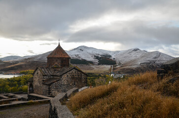 Sevanavank historic armenian orthodox Monastery complex above Sevan lake and snowy mountains on background. Armenia
