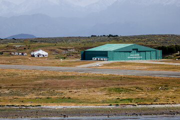 Ushuaia, Argentina - December 28, 2022: A hangar alongside the runway of the airport at Ushuaia,...