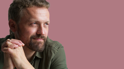 Portrait of man isolated on pink background. Ideal image to accompany articles or content related to men's lifestyle, habits, interests. Masculinity, showcasing man's fashion, style, and grooming