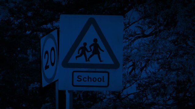 School Sign Outside At Night