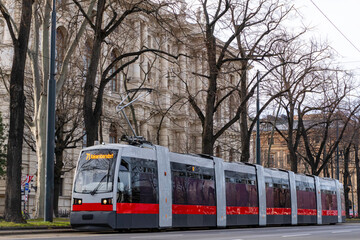 Modern tram in the streets of Vienna on a late winter afternoon.
